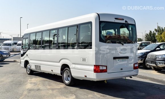 Acheter Import Voiture Toyota Coaster Blanc à Import - Dubai, Estuaire Acheter Import Voiture Toyota Coaster Blanc à Import - Dubai, Estuaire