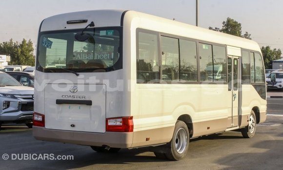 Acheter Import Voiture Toyota Coaster Blanc à Import - Dubai, Estuaire Acheter Import Voiture Toyota Coaster Blanc à Import - Dubai, Estuaire