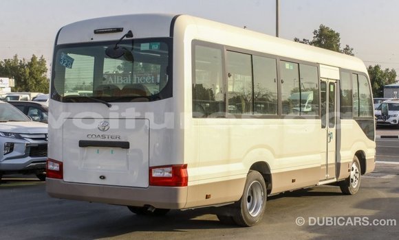 Acheter Import Voiture Toyota Coaster Blanc à Import - Dubai, Estuaire Acheter Import Voiture Toyota Coaster Blanc à Import - Dubai, Estuaire