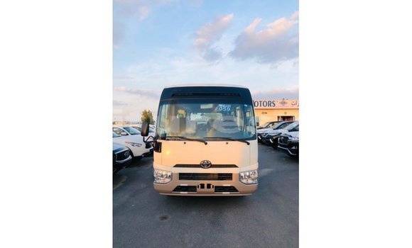 Acheter Import Voiture Toyota Coaster Blanc à Import - Dubai, Estuaire